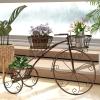 imageGiantex Metal Bicycle Planter 3 Tier Tricycle Flower Plant Stand w 3 Decorative Wheels Parisian Style Flower Display Stand Cart for Home Decor Patio Garden Flower Shop Indoor OutdoorBronze